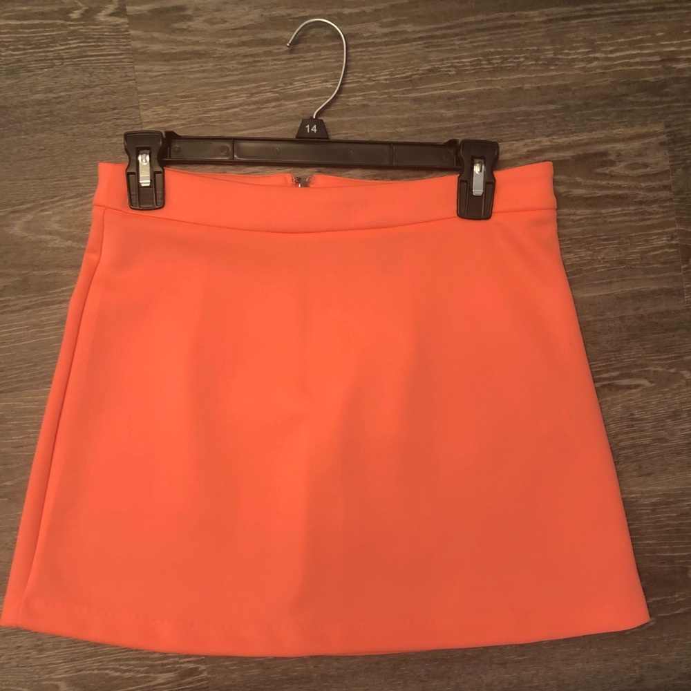 peach/ flamingo colored skirt